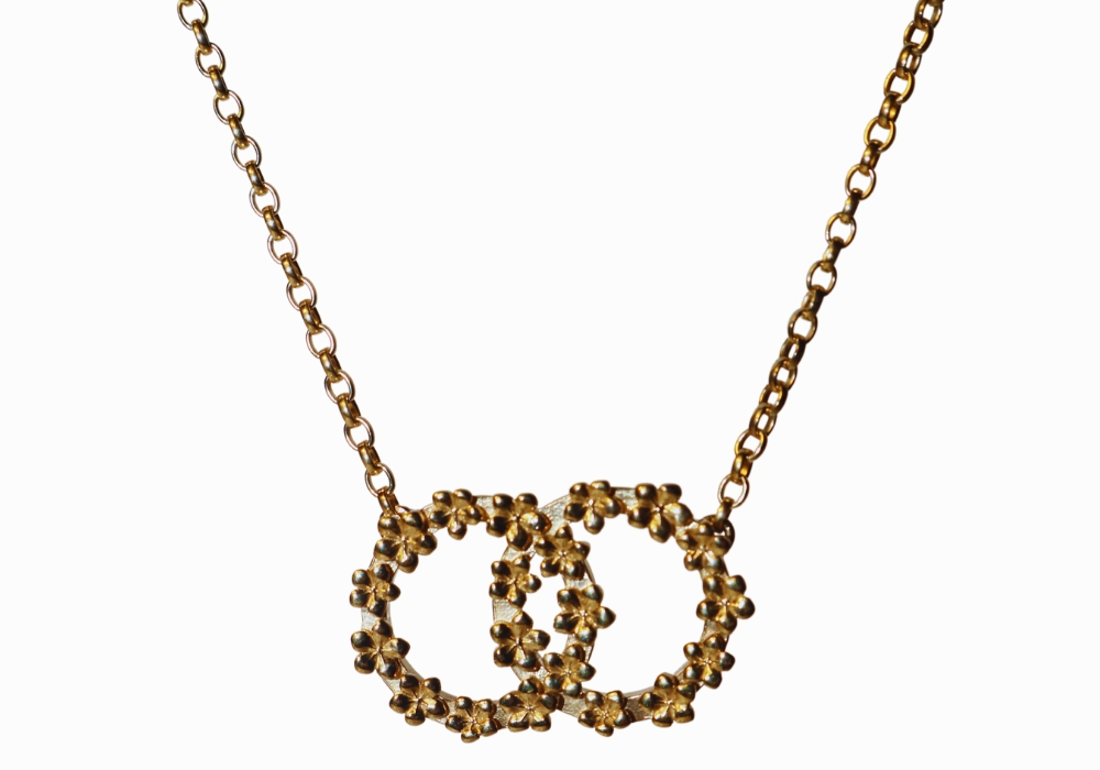 The Forget-Me-Not 'Love Link Wreath' Silver Necklace layered in Fairmined Gold