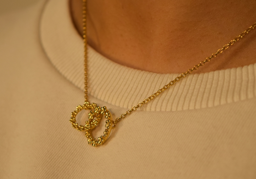 The Forget-Me-Not 'Love Link Wreath' Silver Necklace layered in Fairmined Gold